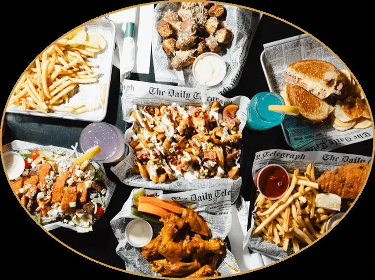 Top-down view of various fried comfort foods and drinks on a table.