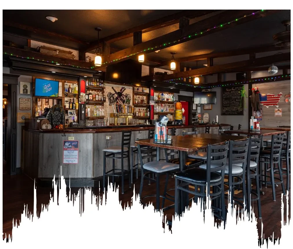 Rustic bar interior with Halloween decor showing Quick Draw on screen.