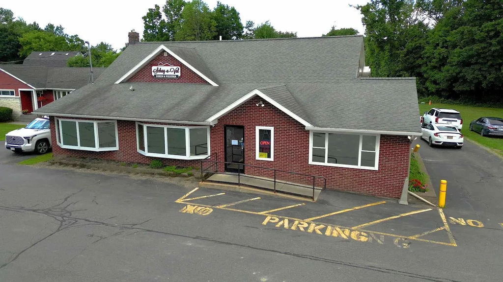 Aerial view of single-story brick Schoep-n-Vail Diner & Pizzeria.