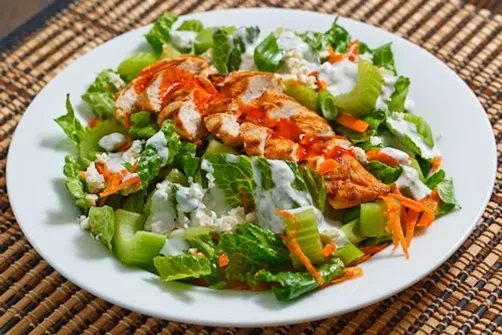 Buffalo chicken salad with lettuce, celery, carrots, and blue cheese.
