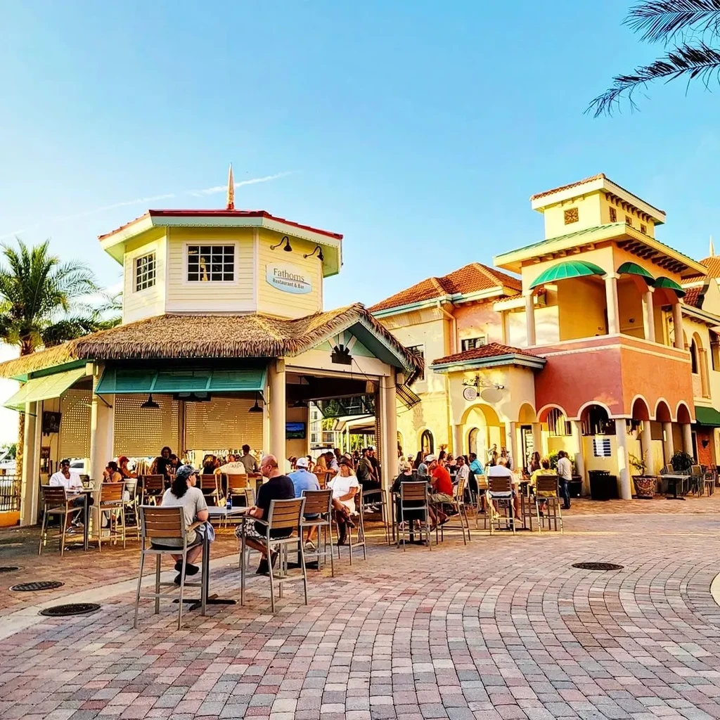 Lively Fathoms Restaurant & Bar with a thatched-roof patio.