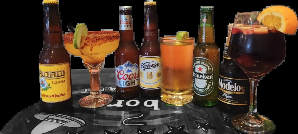 A line of beer bottles and cocktails against a black background.