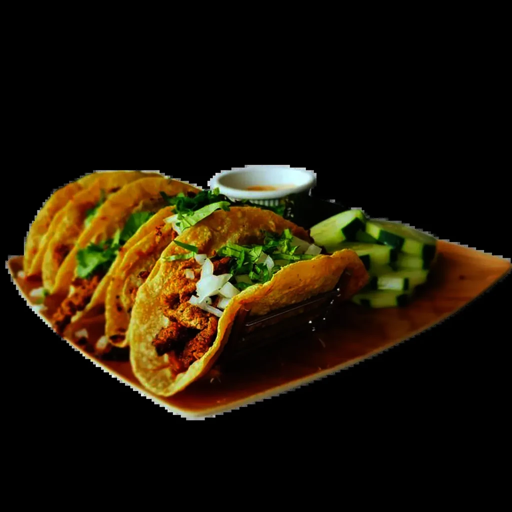 Crispy meat tacos with onions, cilantro, sauce, and cucumber.