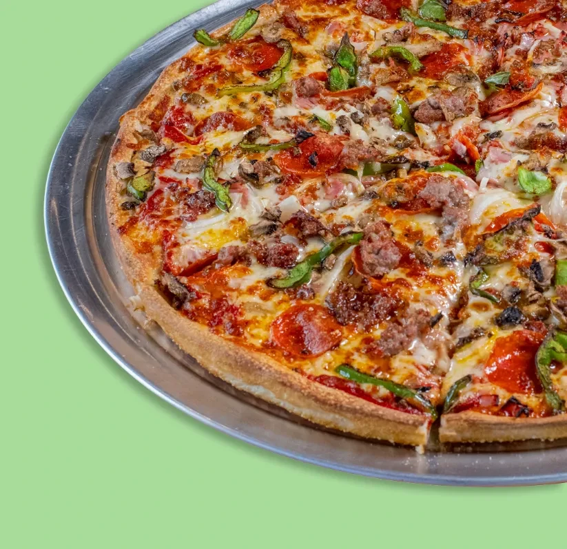 Large baked pizza with pepperoni, sausage, vegetables, melted cheese, one slice separated.