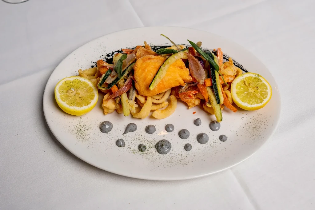 Crispy fried seafood and vegetables with lemon and herbs.
