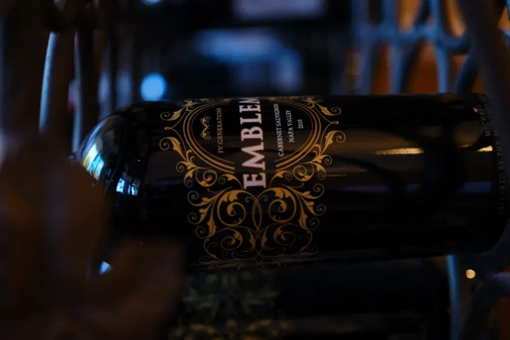 Black and gold "EMBLEM" Cabernet Sauvignon wine bottle, vintage 2018.