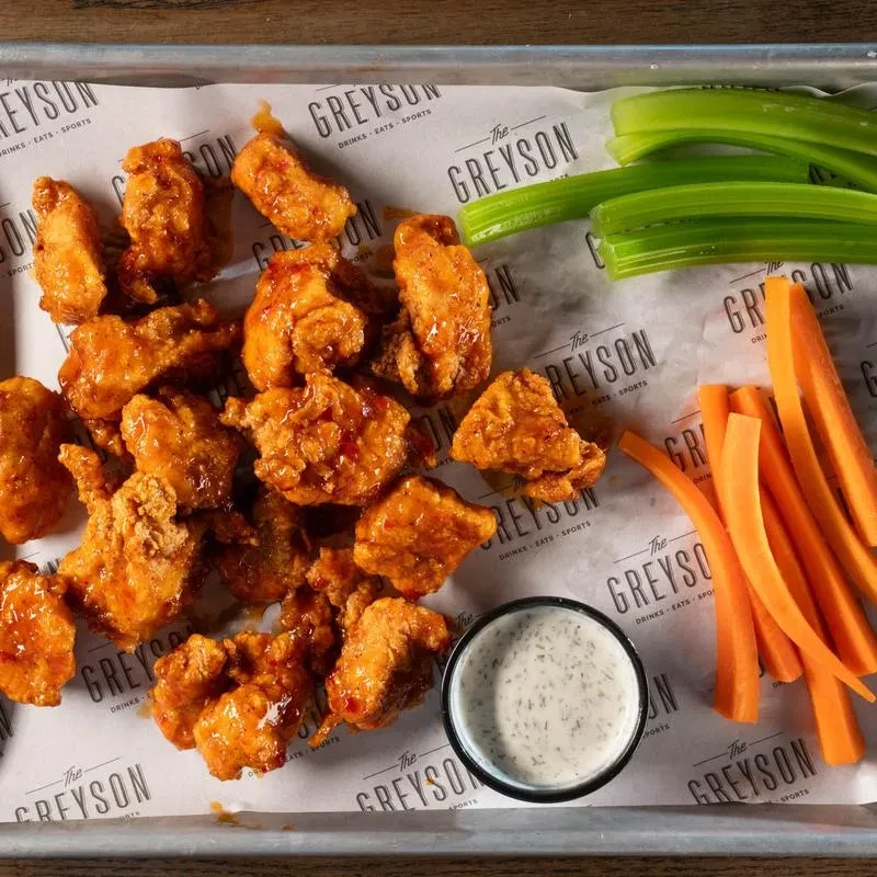 Sauced boneless chicken wings, celery, carrots, and creamy dip.