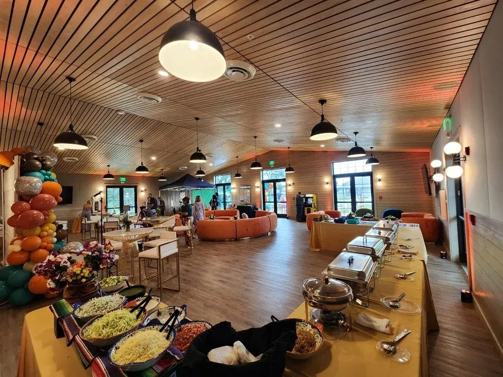 Spacious, festive event hall with taco bar and hot food buffet.