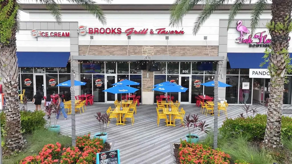 Vibrant modern plaza featuring Brooks Grill, Ice Cream, outdoor patio.