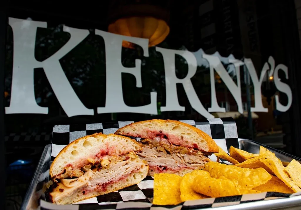 Sliced turkey and cranberry sandwich with chips from Kerny's.