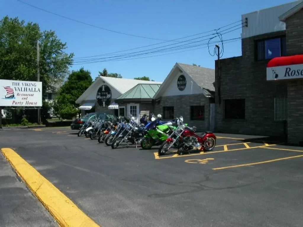 Viking Valhalla restaurant, stone buildings, and motorcycles in the parking lot.