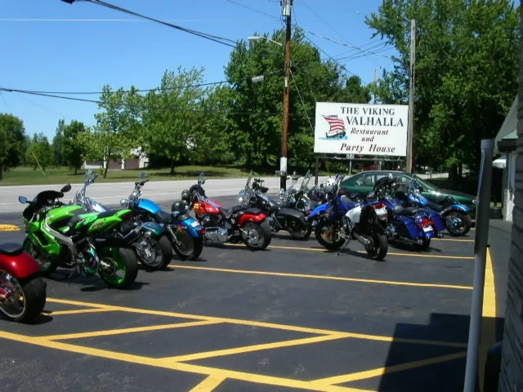 Numerous colorful motorcycles parked at The Viking Valhalla Restaurant.