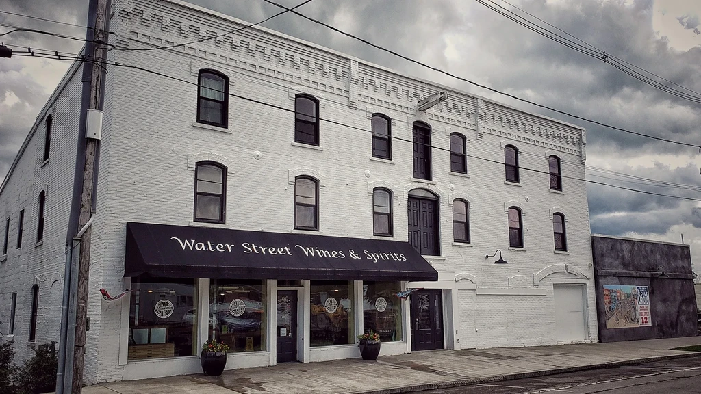 Water Street Wines & Spirits, a two-story white brick building.