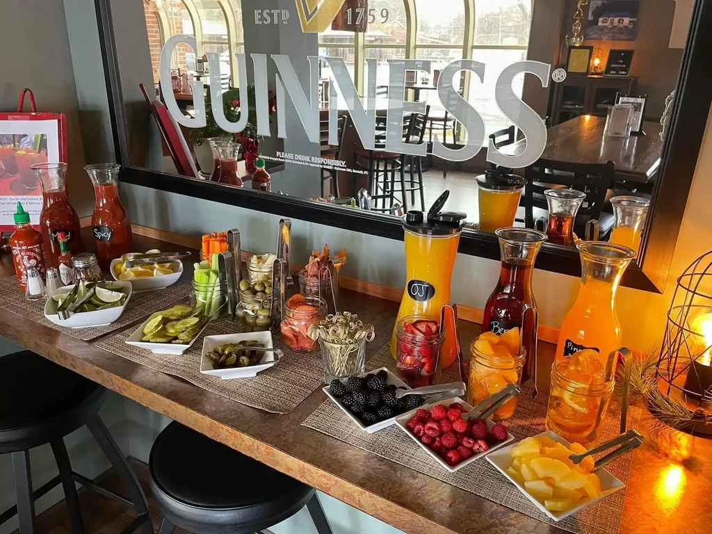 A well-stocked self-serve Bloody Mary and Mimosa bar with garnishes.