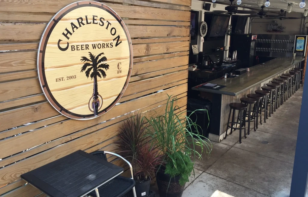 Exterior view of Charleston Beer Works sign and interior bar.