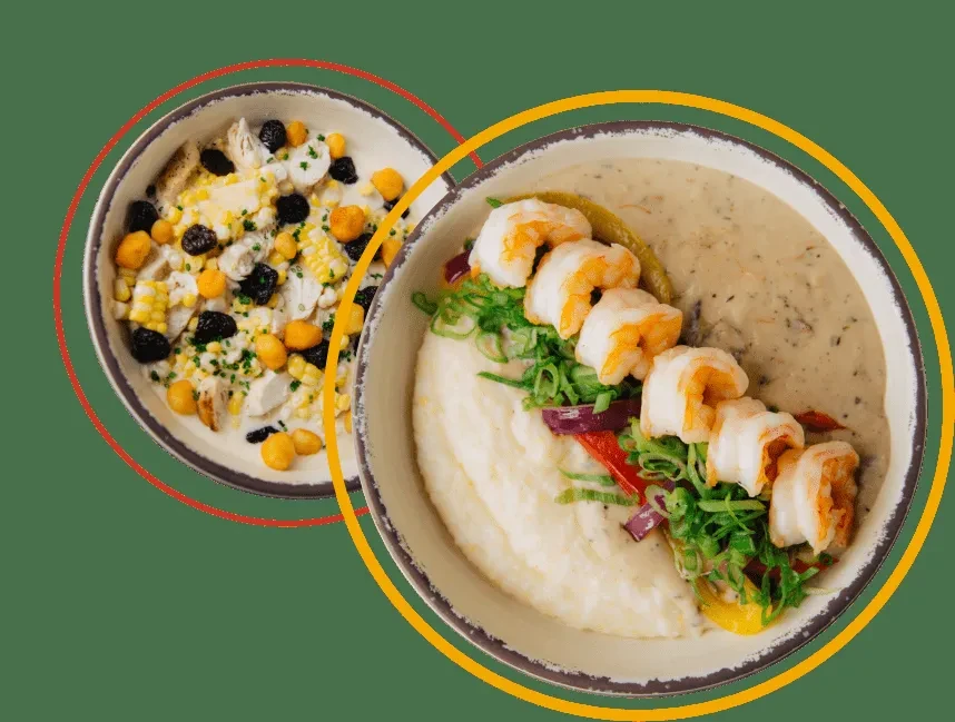 Two rustic bowls of diverse food, including shrimp, corn, and vegetables.