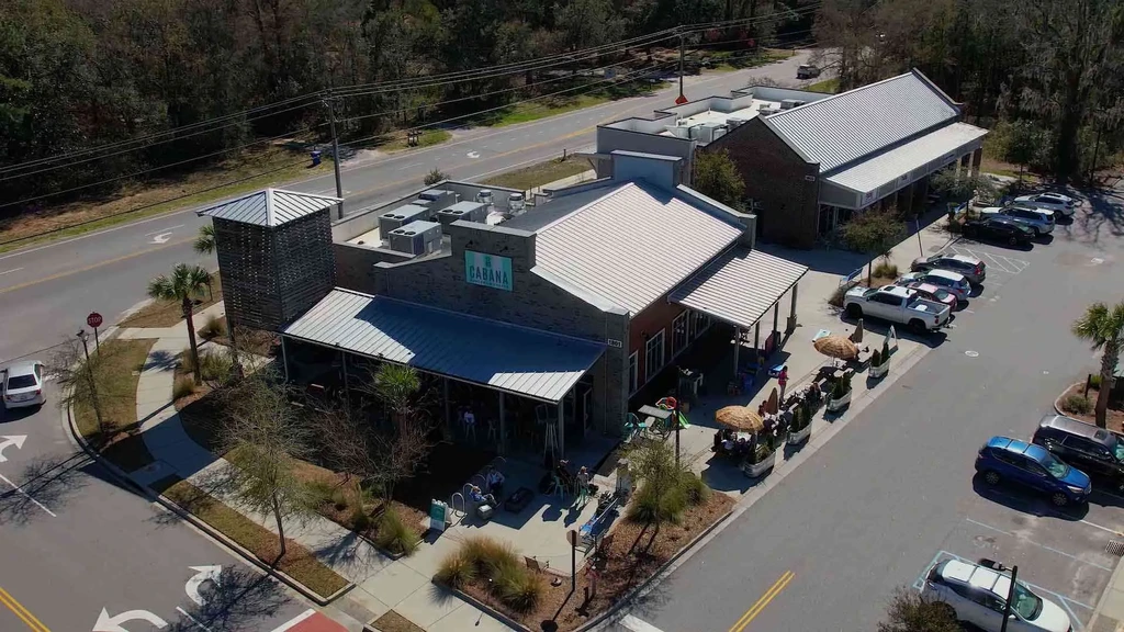 Aerial view of CABANA restaurant with outdoor patio and parking lot.