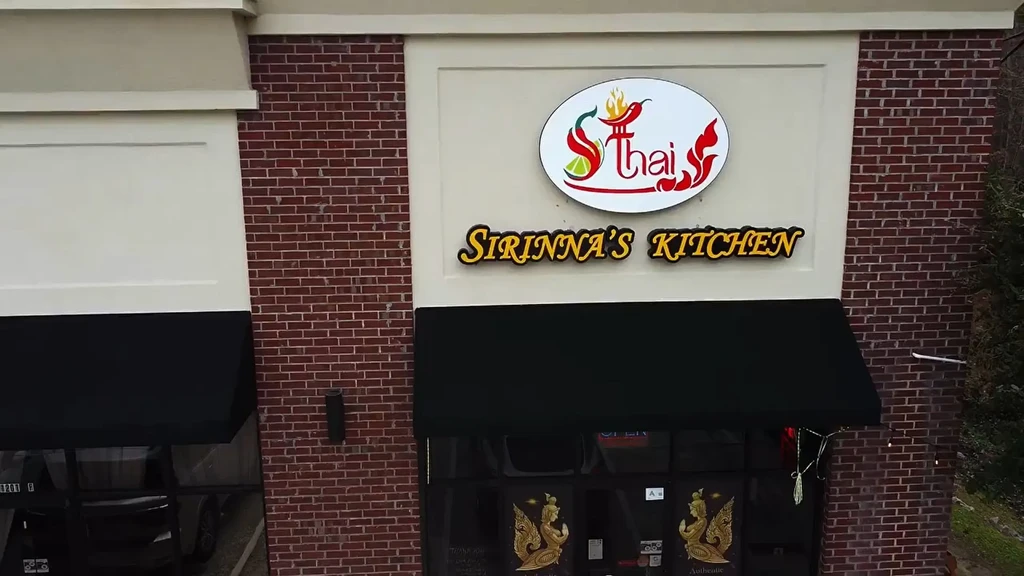 Sirinna's Kitchen Thai restaurant facade with brick, 'S Thai' sign.