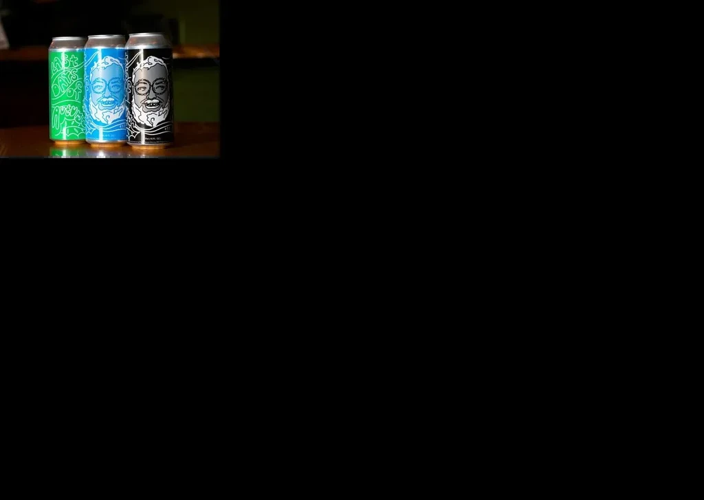 Three green, blue, black cans: two with bearded faces, one with text.