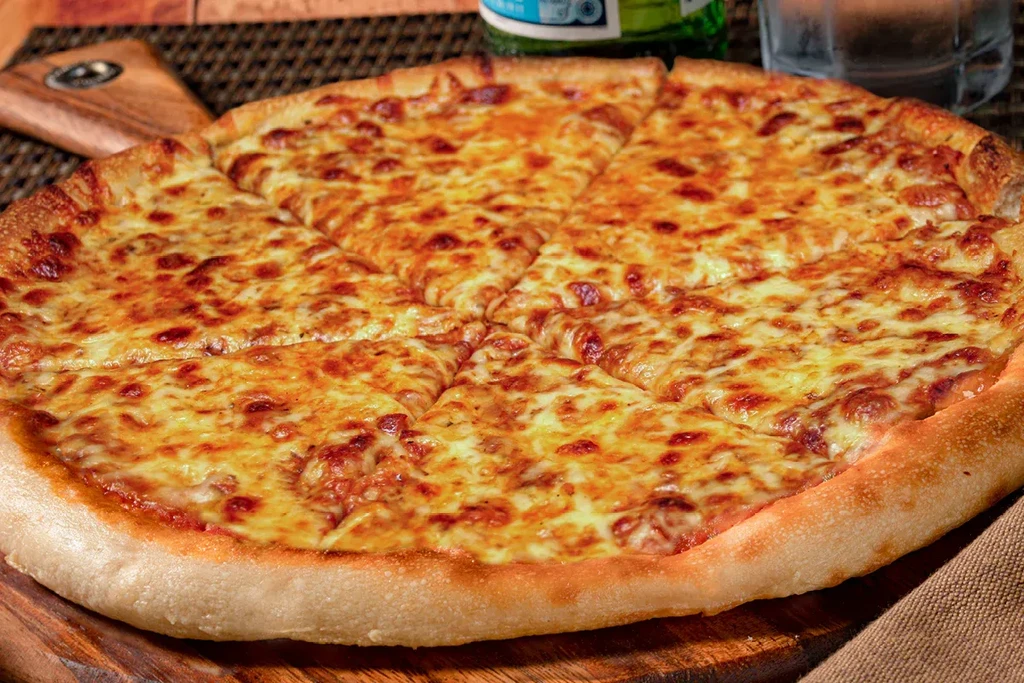 Bubbling, sliced cheese pizza on a rustic wooden board.