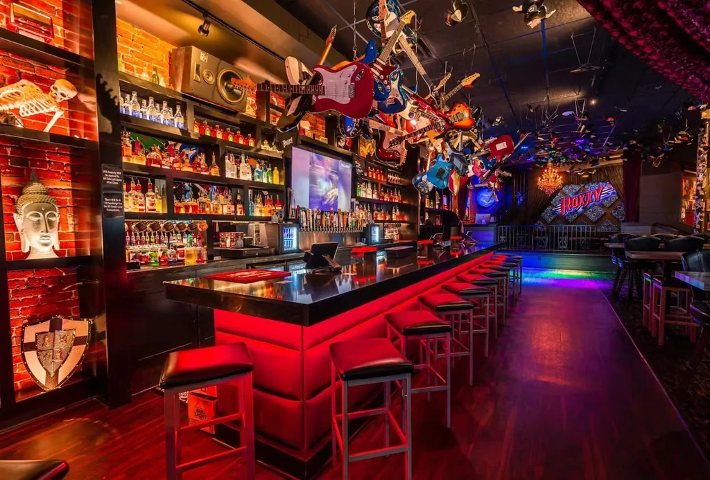 Roxy rock-and-roll bar with suspended guitars and illuminated counter.
