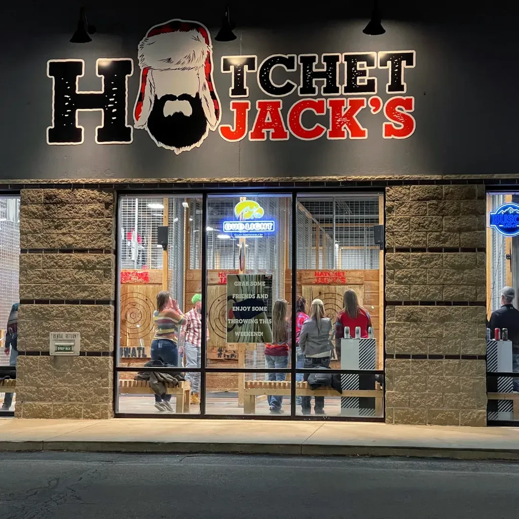 Exterior of Hatchet Jack's axe-throwing venue, people visible throwing axes.