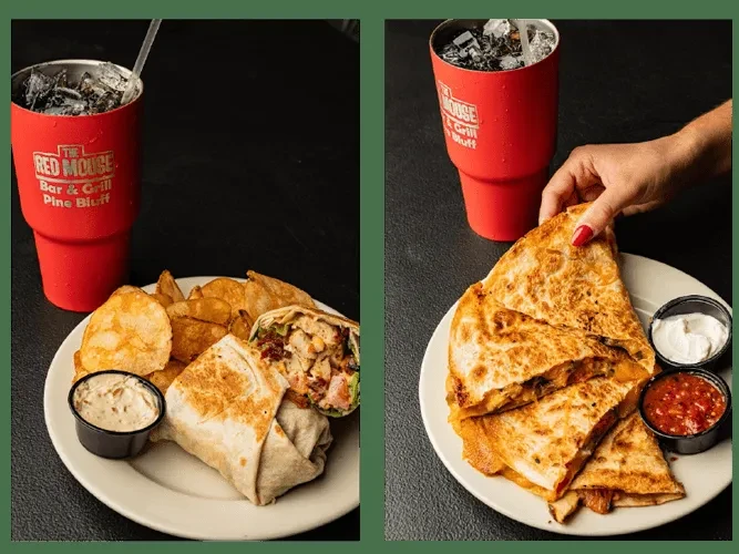 Two plates with wraps, quesadilla, chips, sauces, and a branded red tumbler.