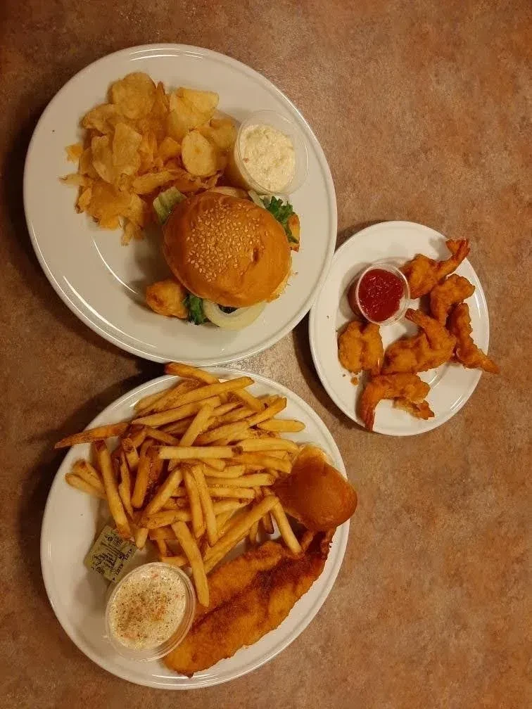 Casual dining plates: burger, fish and chips, and fried shrimp.