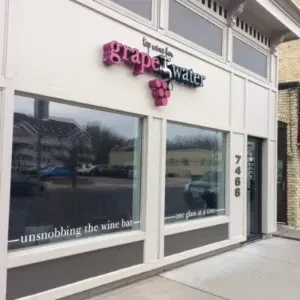Modern white and grey storefront for the grapewater wine bar.