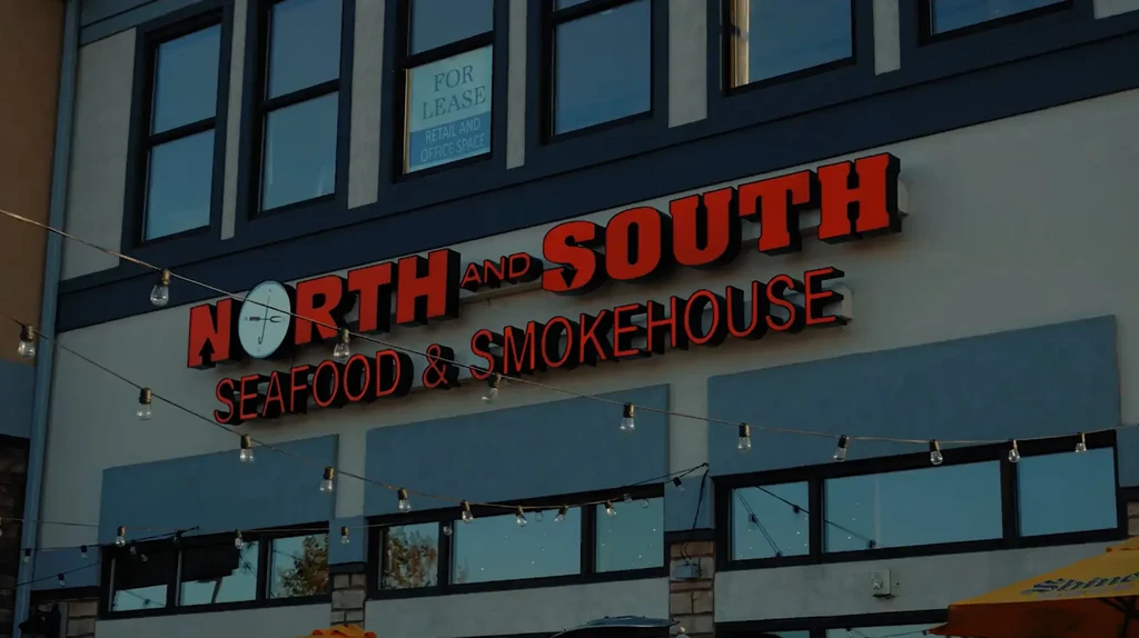 Facade of "NORTH AND SOUTH SEAFOOD" restaurant, with "FOR LEASE" sign.