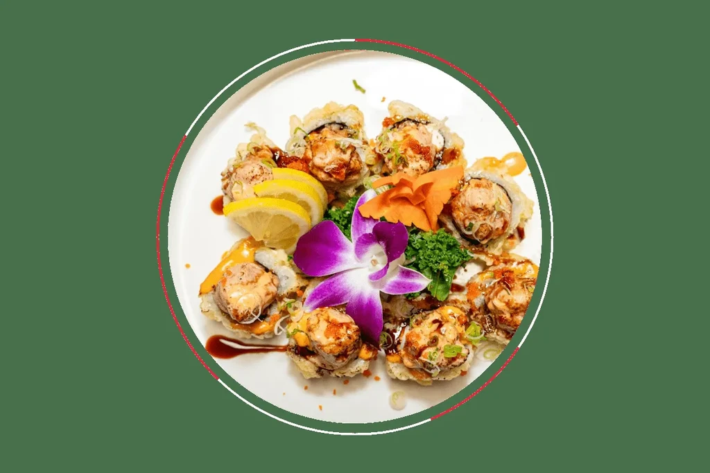 Circular arrangement of fried sushi rolls, garnished with orchid, lemon, and herbs.