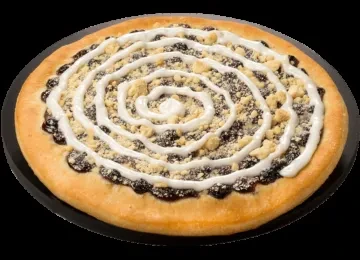 Round sweet pastry with dark filling, crumbs, and white icing spiral.