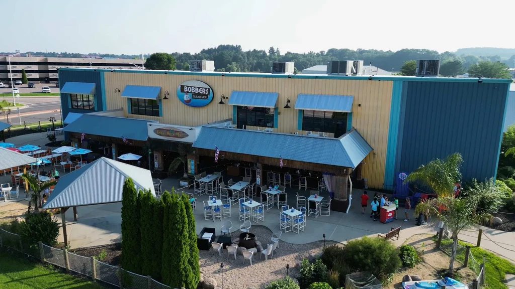 Bobbers Island Grill: elevated exterior of island-themed building and lively patio.