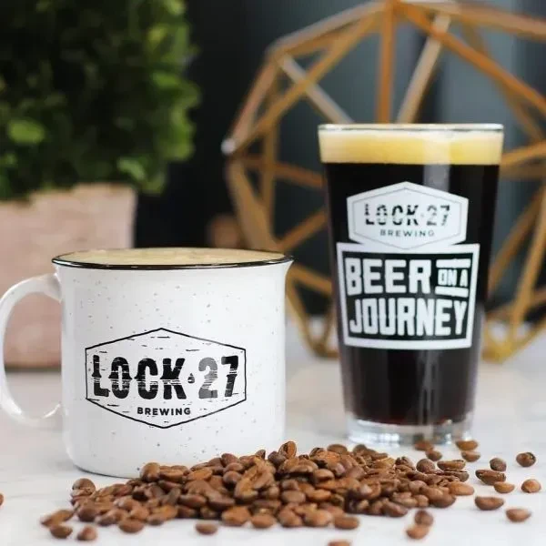 Still life of Lock 27 Brewing mug, beer, and coffee beans.