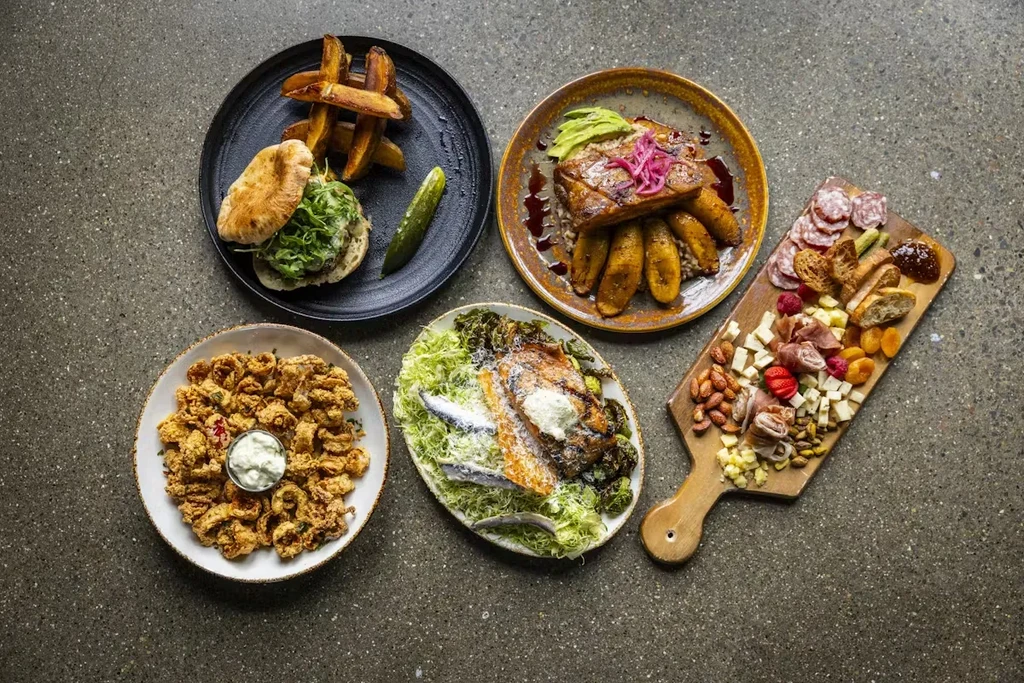 Five distinct restaurant dishes: burger, charcuterie, calamari, fish, and meat.
