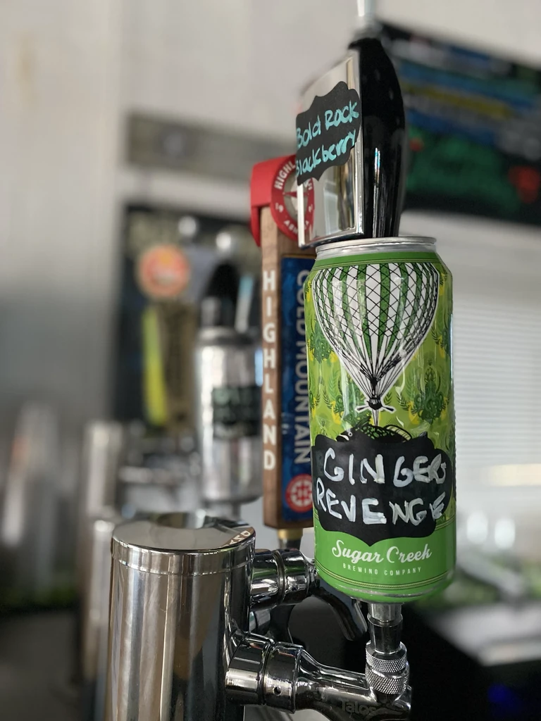 Green "GINGER REVENGE" beer can with hot air balloon as a tap handle.