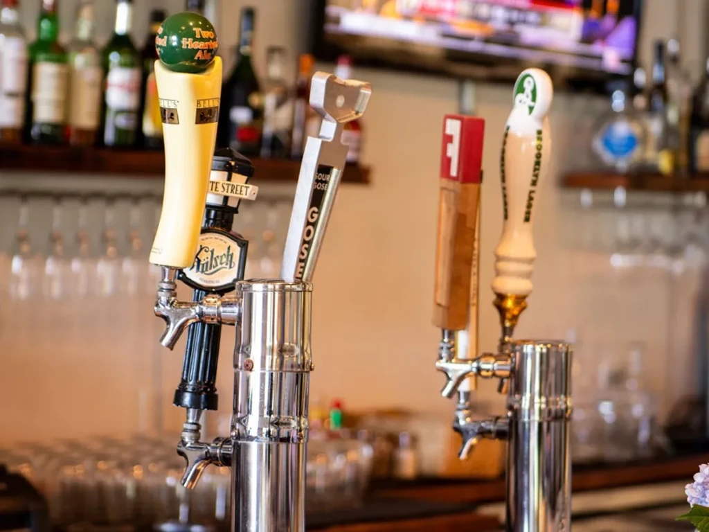 Beer taps for Two Hearted Ale, Kolsch, Goose, and Brooklyn Lager.
