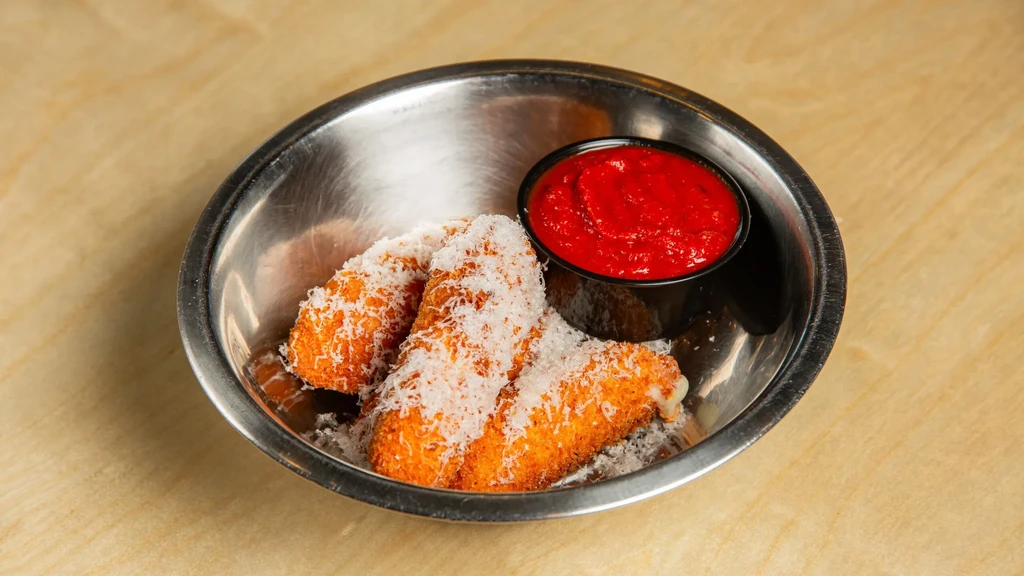 Three fried food items with Parmesan cheese and marinara sauce.