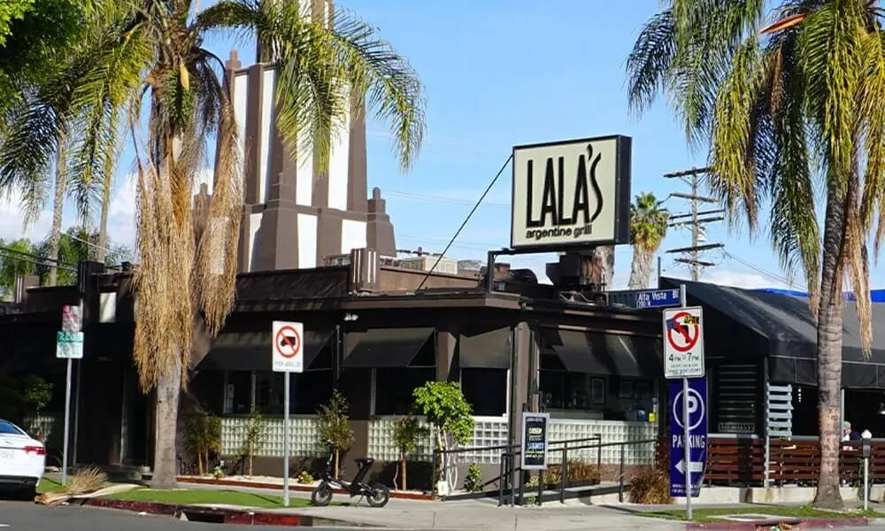 Dark Lala's Argentine Grill building on sunny Alta Vista Boulevard.