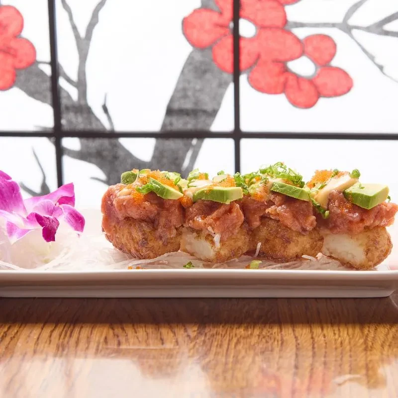Four crispy rice cakes with spicy tuna, avocado, and roe.