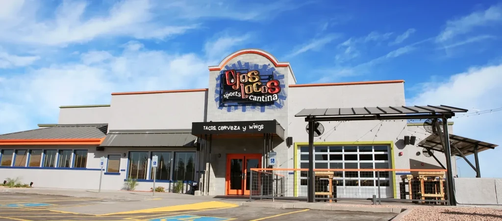 Exterior of Ojos Locos Sports Cantina restaurant with patio.