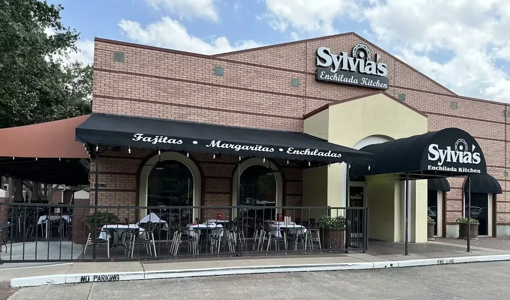 Sylvia's Enchilada Kitchen exterior with patio, awnings, and no parking curb.