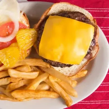 Deconstructed cheeseburger with fries on a red and white tablecloth.