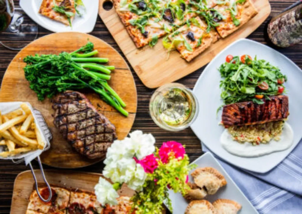 Top-down view of a dining table laden with various dishes.