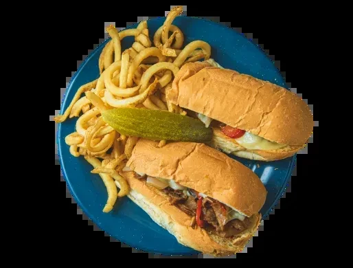Two submarine sandwiches, curly fries, and a pickle spear.