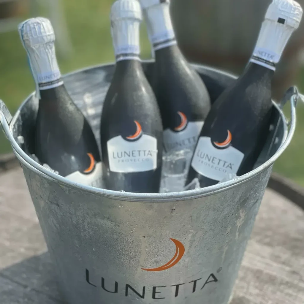 Galvanized bucket of ice and four bottles of Lunetta Prosecco.