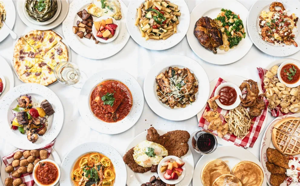 Overhead view of a large spread of various dishes.