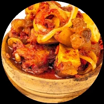 Close-up of a savory stew in a light brown wooden bowl.