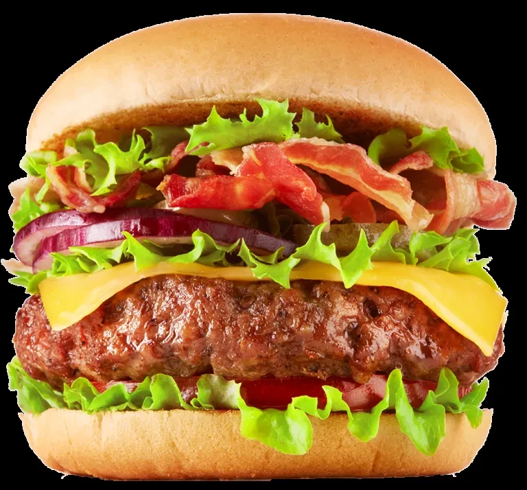 Neatly layered hamburger with bun, patty, cheese, lettuce, bacon, and vegetables.