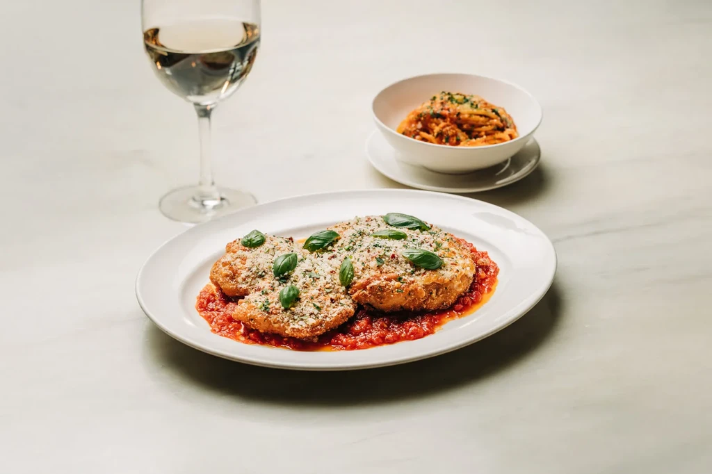 Chicken or veal cutlets with cheese, basil, and marinara sauce.
